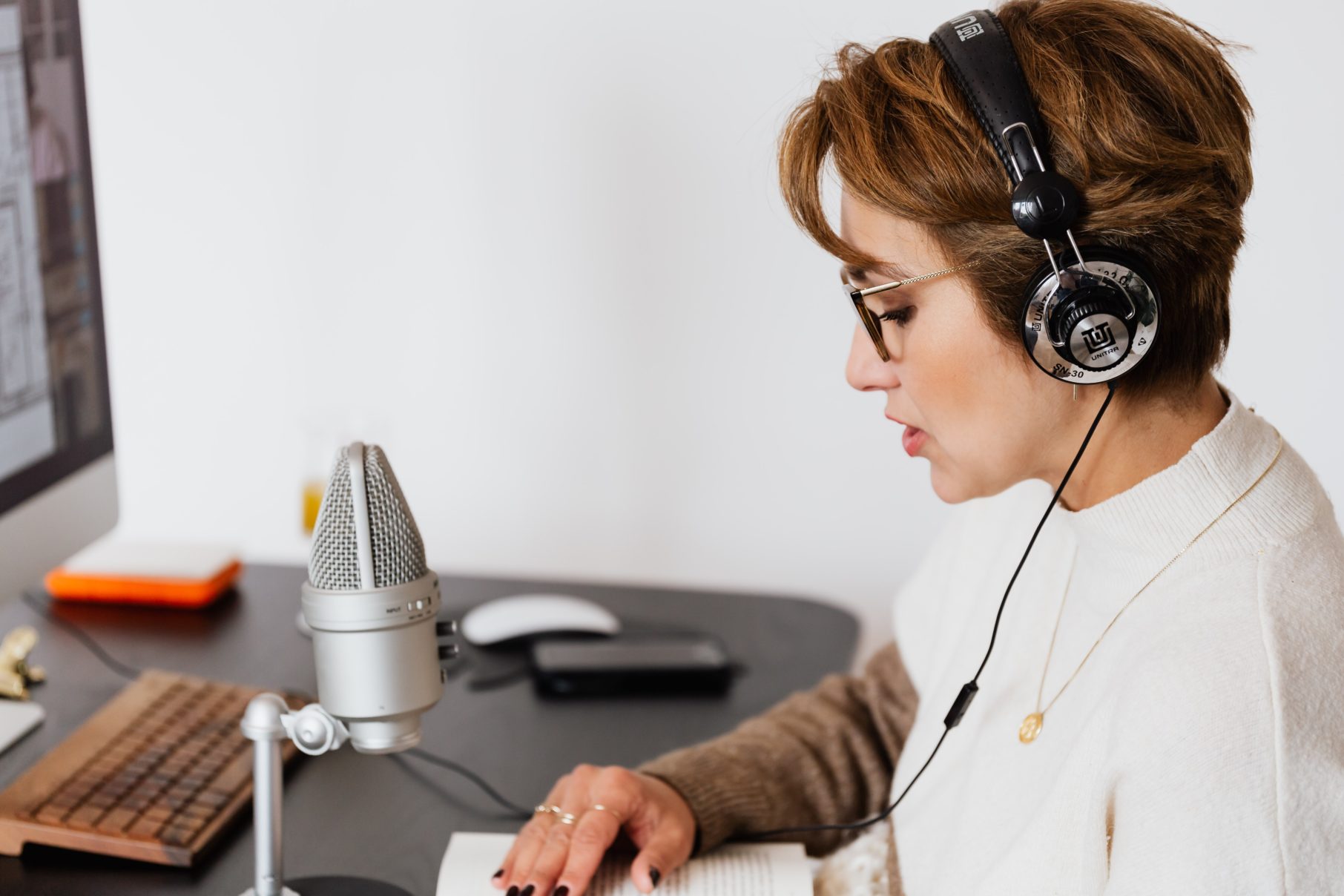 woman recording at desk